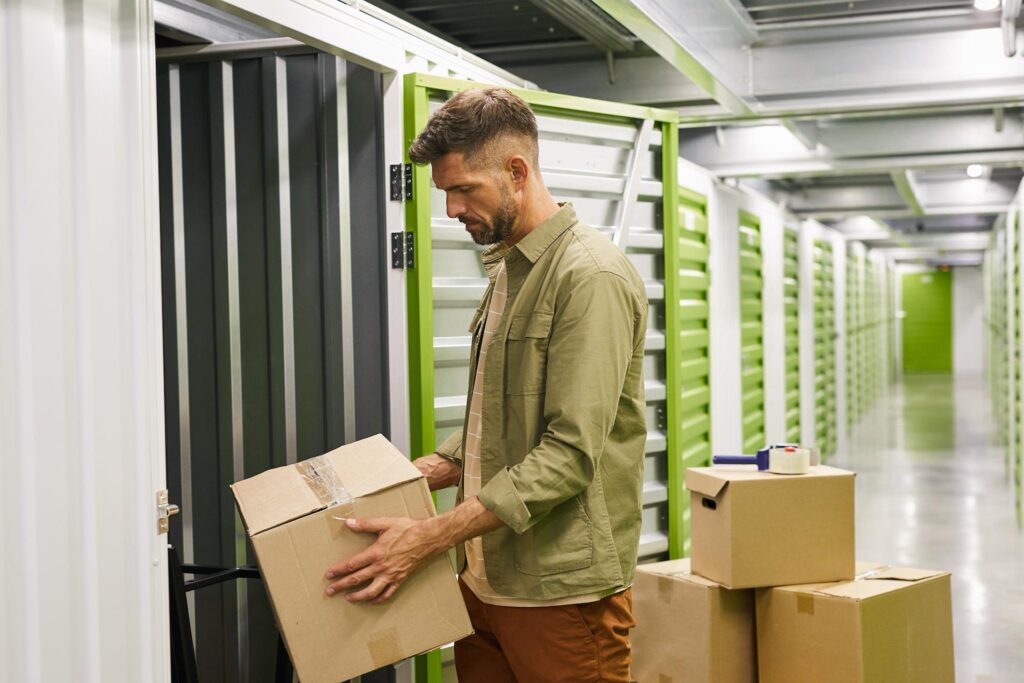 man loading storage unit 1